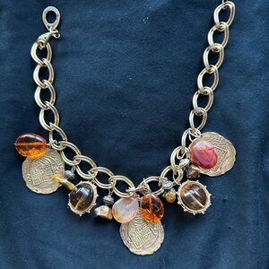Vtg Les Bernard gold-tone Medalion and lucite Charm Necklace brown Accent choker